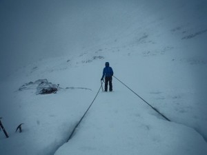 Abseiling off a snow bollard