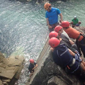 Group climbing at Porth Clais