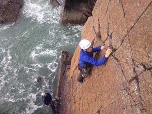 Alec leading Red Wall, Porth Clais