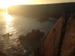 Alun and Briony from Dragon Activity Guides belaying at the top of Porth y Fynnon in the sun!