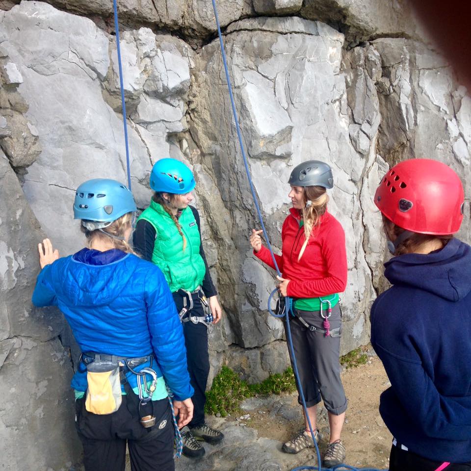 Charlotte briefing the belayers during her SPA training in Pembrokeshire