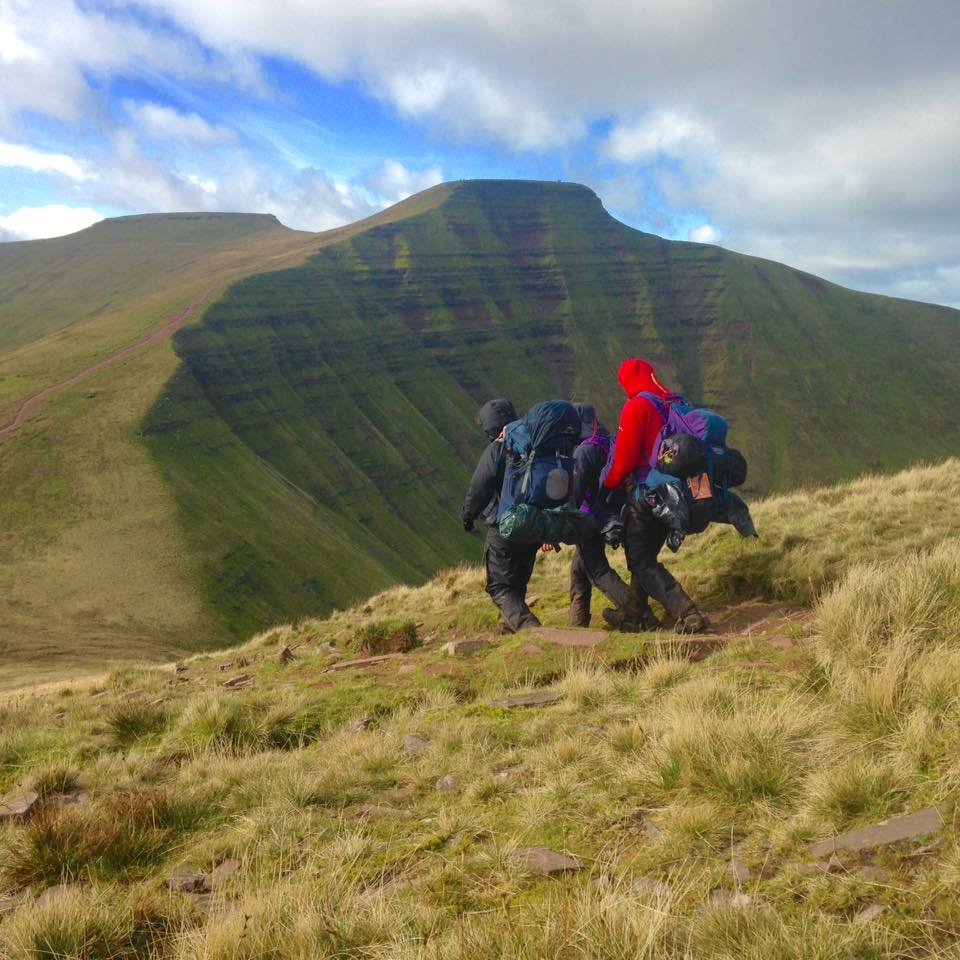 The team on their Gold DofE exped nearing the summit of Pen y Fan