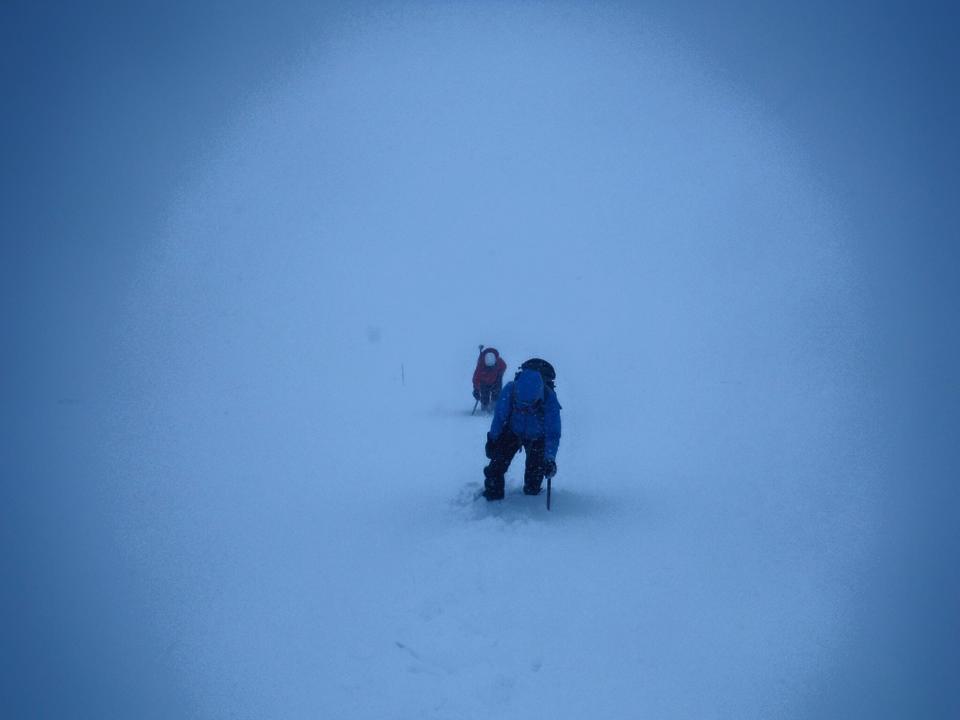 It doesn't have to be snowing for the visibility to be poor... What you cant see is the massive cliff just to these Mountaineers side... Your Navigation needs to be strong in Winter!