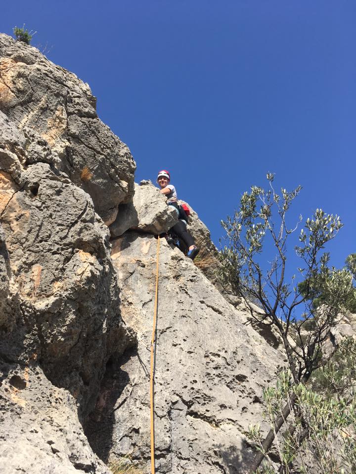 Joey leading the final pitch of Albahida, with 300m of air below her feet..