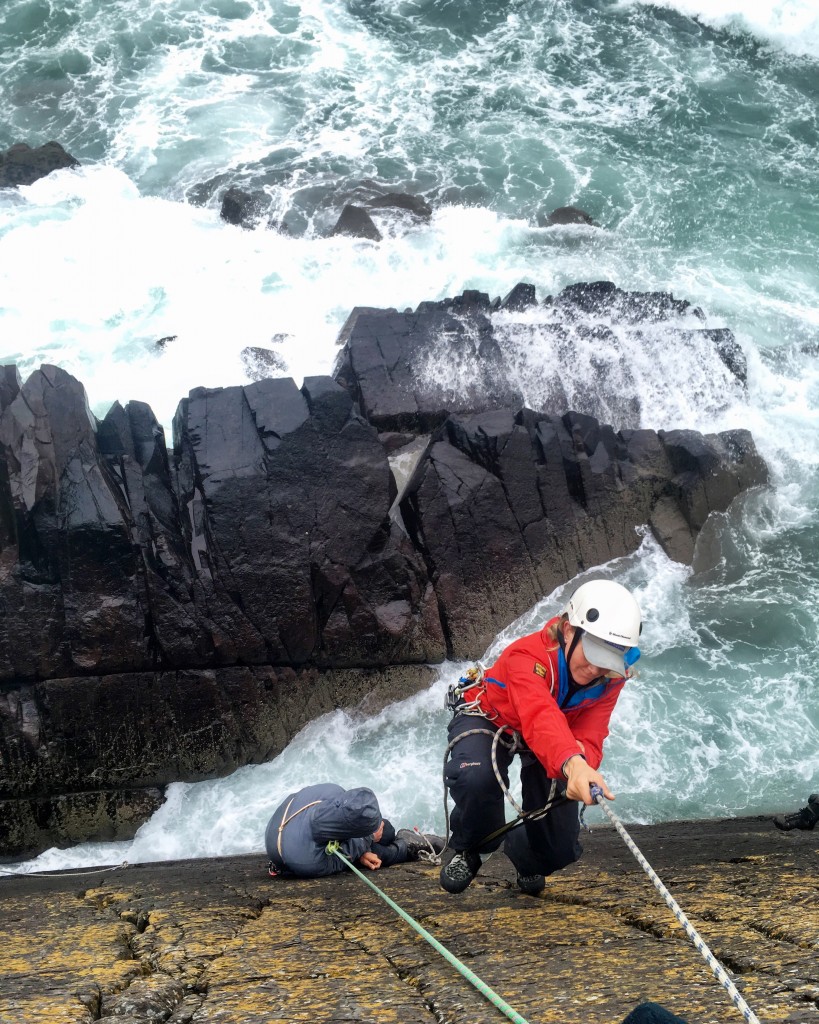 TYF guide Rachel getting assessed in her sea cliff climbing skills, rescuing an unconscious Matt here...