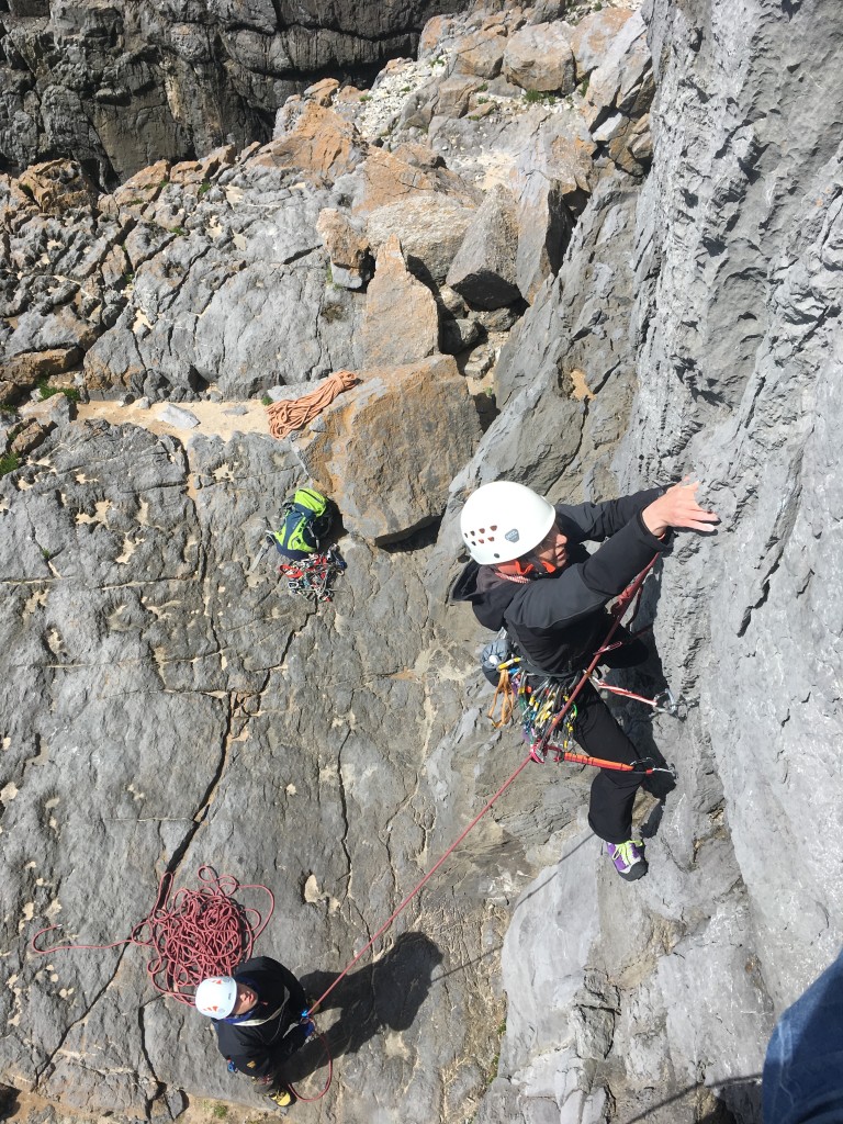 Hazel leading a steep VS while gaining new sea cliff climbing skills in Pembrokeshire