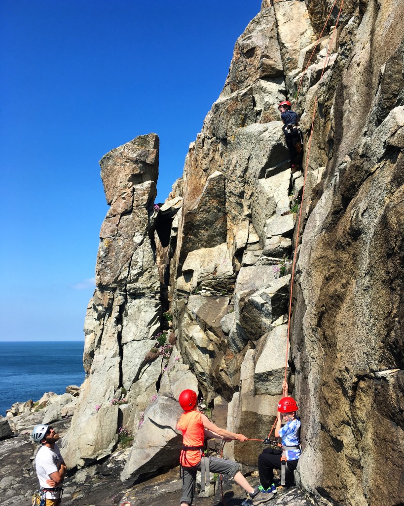 Bottom roping at St Davids Head, a great group climbing spot in Pembrokeshire.