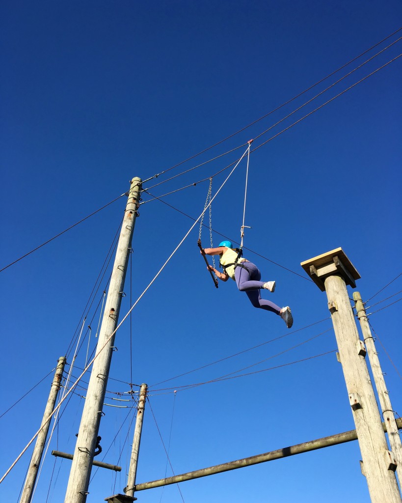 Leap of faith on to the trapeze at Newgale Lodge High ropes course...